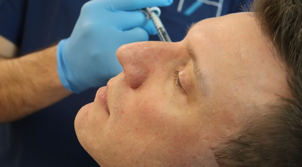 Doctor undergoing training to avoid aesthetic treatment errors.